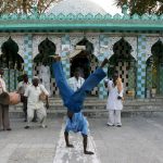 Sidi musicians perform outside a mosque in the village of Jambur. (AFP)