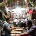 Men play backgammon on the streets in a public coffee shop decorated for Ramadan in Cairo on September 1 2010. (Pic: Reuters)