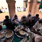 Men break their fast on the first Friday of Ramadan in a mosque at Umdowan Ban village outside Khartoum on August 5 2011. (Pic: Reuters)