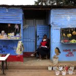 A woman waits for customers outside her shop in a Nairobi slum. (Pic: Reuters)