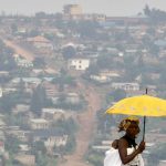 A woman walks on a main street of Rwanda's capital Kigali. (Pic: Reuters)