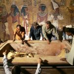 King Tutankhamun is removed from his stone sarcophagus in an underground tomb in the famed Valley of the Kings in Luxor. (Pic: AFP)