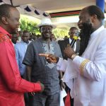 President Uhuru Kenyatta (L) and Raila Odinga (C), attend a prayer meeting on February 24 2013 led by David Owuor (R). (Pic: AFP)