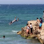 Young Libyans in the Mediterranean Sea off the coast of Tripoli. (Pic: AFP)