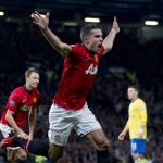 Manchester United's Robin van Persie celebrates after scoring against Arsenal during their league match at Old Trafford Stadium on November 10. (Pic: AP Exchange)