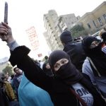 An Egyptian protester holds up a knife during a demonstration to demand an end to sexual violence against women on February 6 2013 in the Egyptian capital of Cairo. (Pic: AFP)