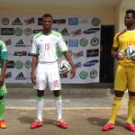 Super Eagles midfielder Abdullahi Shehu (C), striker Ejike Uzuoenyi (L) and keeper Chigozie Agbim (R) pose with Nigeria's new official jersey for the 2014 World Cup in Brazil in Abuja on February 27. (Pic: AFP)