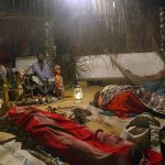 European women rest in a temple after taking iboga during an initiation to the Bwiti rite in September 2005, in Libreville. (Pic: AFP)