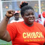 Fidelis Olubukola, a member of the Civil Society, Women Advocate Research and Documentation Centre, chants slogans for the release of the schoolgirls kidnapped by Boko Haram during a workers' rally in Lagos on May 1 2014. (Pic: AFP)