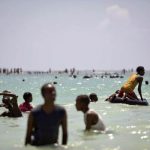 Somalis enjoy a swim in Lido Beach, Mogadishu. (Pic: AFP / AU-UN IST)