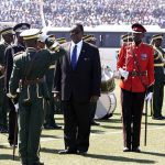 A military officer salutes Peter Mutharika during his official inauguration as Malawi's new President on June 2 2014. (Pic: AFP)