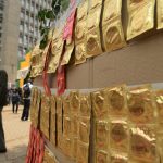 Kenyans walk past condoms exhibited in the streets as workers distribute them on February 14 2014 to promote safe sex practices during the Valentine week and to mark International Condom Day. (Pic: AFP)