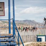 African migrants sit on top of a border fence between Morocco and Spain's north African enclave of Melilla during their latest attempt to cross into Spanish territory, on April 3 2014. (Pic: Reuters)