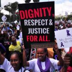 Women at Monday's rally chant slogans in support of the woman who was attacked and stripped. (Pic: AFP)