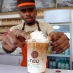 A Cafe Neo steward prepares iced coffee for a customer. (Pic: AFP)