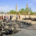 Investigators at the scene of the Kano Central Mosque bombing on November 29 2014. Gunmen set off three bombs and opened fire on worshippers at the main mosque in north Nigeria's biggest city Kano, killing at least 81 people. (Pic: AFP)