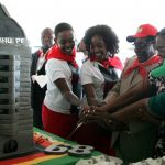 President Robert Mugabe cuts his birthday cake with his children and his wife Grace Mugabe during a 21st February Movement celebrations rally held in honor of his 89th birthday at Chipadze stadium in Bindura on March 2 2013. (Pic: AFP)