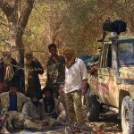 Fighters from the Tuareg separatist rebel group MNLA take shade under a tree in the desert near Tabankort. Mali's government and Tuareg-led rebels resumed U.N.-sponsored peace talks in Algeria on Monday in pursuit of an accord to end uprisings by separatists seeking more self-rule for the northern region they call Azawad. Picture taken February 13, 2015. (Souleymane Ag Anara, Reuters)