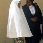 Wasila Tasiu speaks with her defence counsel outside the courtroom during her first day of trial in October 2014. (Pic: AFP)