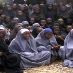 A file screengrab taken on May 12 2014, from a video of Boko Haram obtained by AFP, shows girls wearing the full-length hijab and praying in an undisclosed rural location. (Pic: AFP)