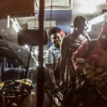 Zimbabwe migrants disembark from a bus on arrival at the International Organisation for Migration Reception and Support Centre in Beitbridge on April 20 2015. (Pic: AFP)