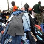 Traders work in Gikomba Market on July 10 2014 in Nairobi. Locally known as "Mitumba", second-hand clothes trade has developed from mainly international charitable donations to become a bustling business sector. (Pic: AFP)