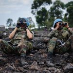 Uruguayan United Nations peacekeepers look through binoculars at M23 rebel positions on the outskirts of Goma, in eastern Democratic Republic of the Congo, on November 18, 2012. (Pic: AFP)